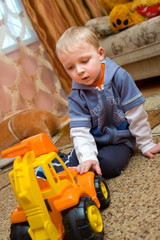 little boy with toy truck