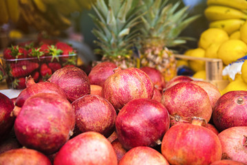 Fruit market - pomegranates, ananas and other fruits