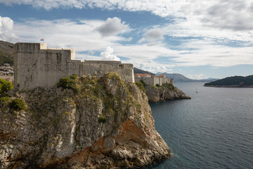 Fototapeta na wymiar Ancient fortress on the cliff edge of Dubrovnik, Croatia protects the por