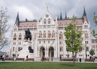 Square with a statue beside Budapest Parliament, Parliament in Budapest symbol, Historical Gothic building of Budapest