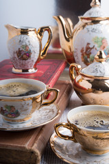 Vintage porcelain coffee cups with hot espresso