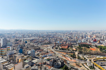 Cityscape of "São Paulo" with blue sky.