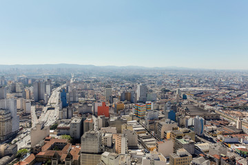 Cityscape of "São Paulo" with blue sky.