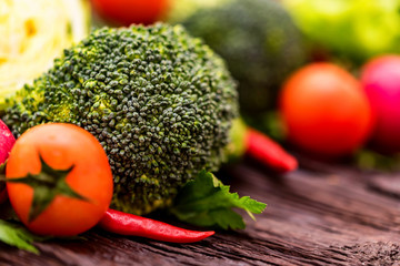 Fresh seasonal vegetables on wooden surface
