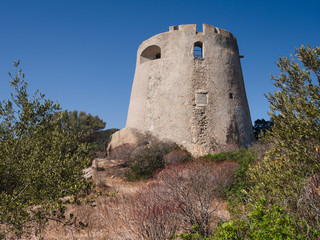 Fototapeta na wymiar The Spanish watchtower of Porto Giunco, Villasimius, Sardinia, Italy,