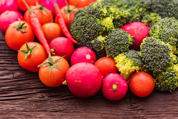 Fresh seasonal vegetables on wooden surface