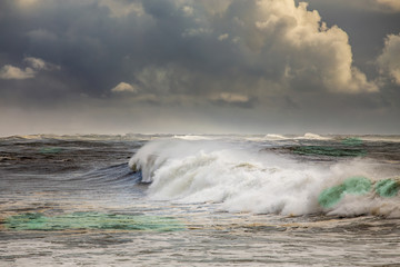 Stormy ocean with big waves and dark clouds
