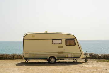 Retro caravan on the shore