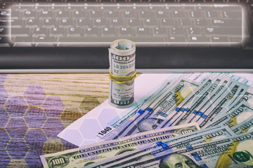 Tax papers in an envelope with 100 dollar bills