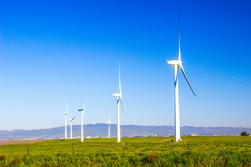 Row Of Energy Producing Windmills In Early Morning
