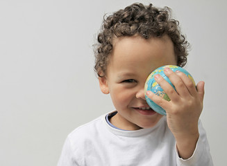 boy holding globe on earth day stock photo