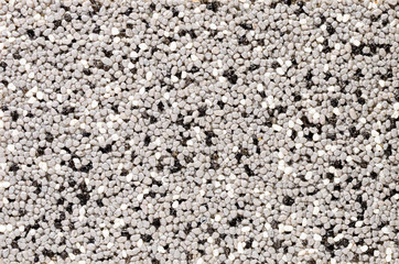 Texture of small multi-colored stones on the wall.