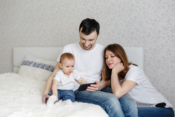 Mom and Dad and show the phone to a small child
