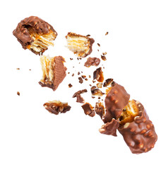 Waffle chocolate bar with nuts broken into parts, isolated on white background