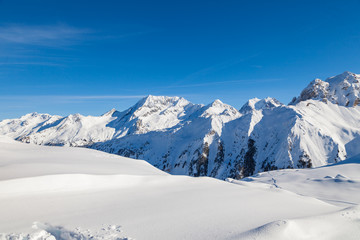 Fototapeta na wymiar Winter panorama of snowy mountain range in 3 Valleys skiing, snowboard resort, Alps, France