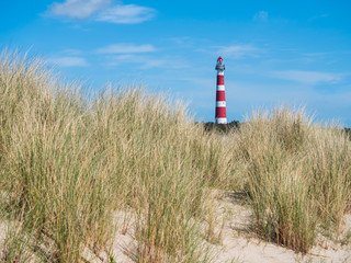 View on lighthouse in the dunes of Ameland, Holland
