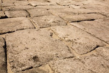 Old sidewalk made of big stones.