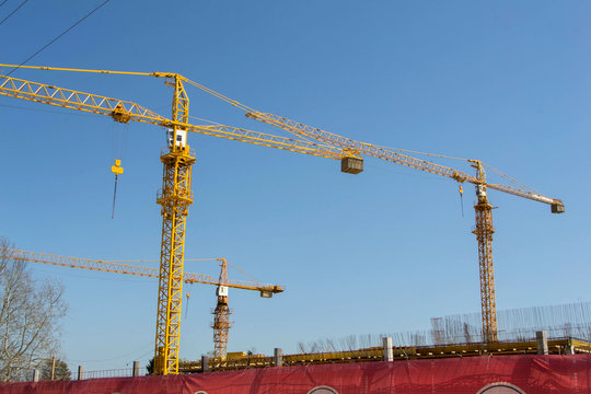 Image of Large industrial crane on a city skyline