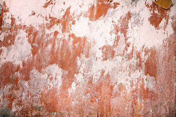 Red plaster wall. Stucco surface background. Grunge scratched concrete panel