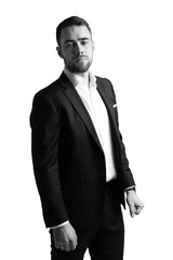 Portrait of young man dressed in business style on white background. Black and white.