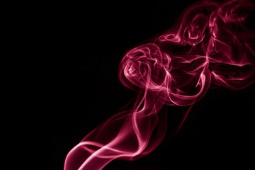 Colored smoke on black background.