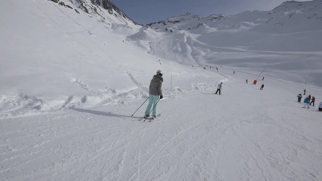 Woman skiing on a ski slope 