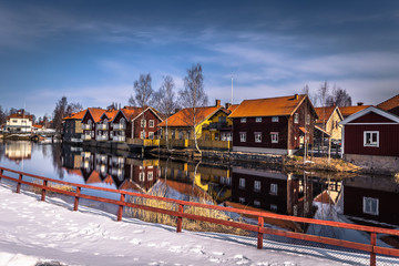 Falun - March 30, 2018: The picturesque wooden houses in the center of the town of Falun in...