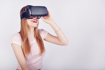 Woman using VR headset. Beautiful girl, VR experience isolated on white. Visual reality concept. Woman getting experience using VR. Future, play.