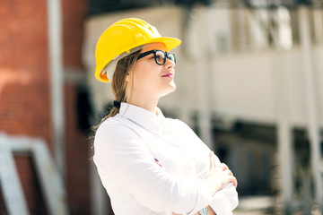Portrait female engineer posing with arms crossed 