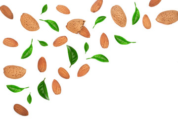 almonds decorated with leaves isolated on white background with copy space for your text. Top view. Flat lay pattern