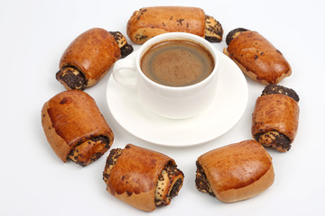 rolls with poppy seeds and white Cup of black coffee