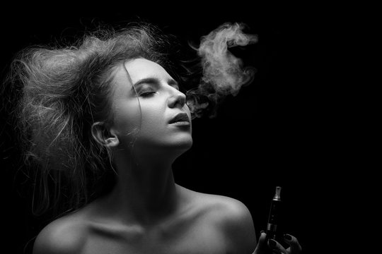woman smoking electronic cigarette