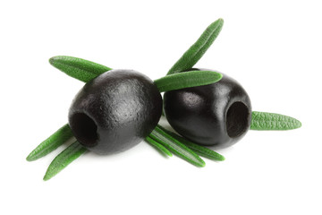 whole black olives with rosemary leaf isolated on white background macro