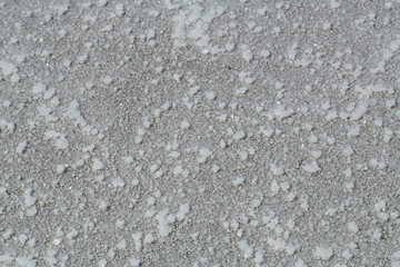 The crystals of salt lie on the dried bottom of the salt lake. Horizontal frame