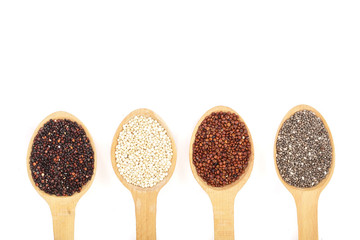 Black red white quinoa and chia seeds in wooden spoon isolated on white background with copy space for your text