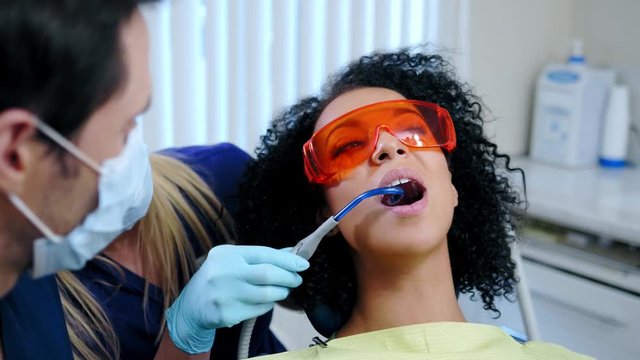 Dentist and his assitant working in private practice.