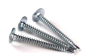 three metal screws isolated on white background closeup