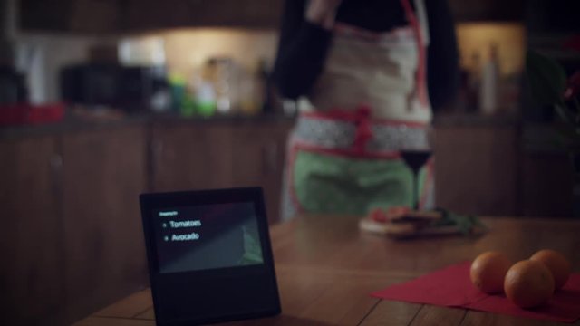 4k Woman Adding to Shopping List on Smart Home Device