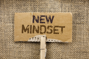 Writing note showing  New Mindset. Business photo showcasing Attitude Latest Concept Vision Behaviour Plan Thinking written on Cardboard Piece Holding By Clip on the jute background.