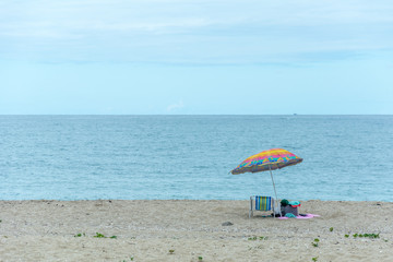 Beach tent with a umbrella on the Armacao Beach, Florianopolis, Brazil.