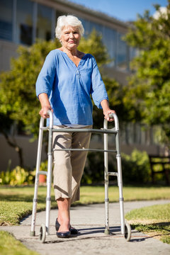 Senior woman posing with her Zimmer Frame