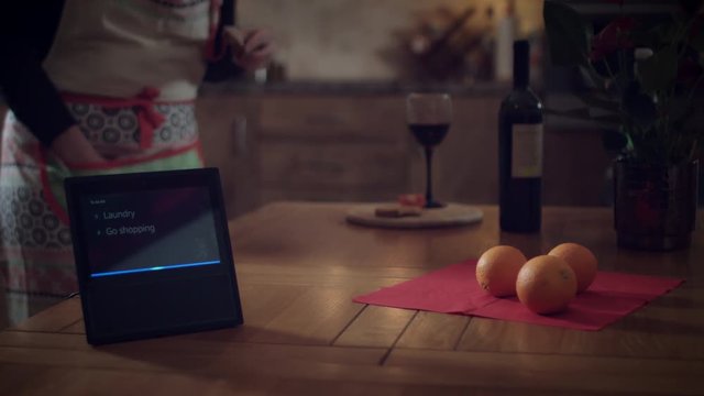 4k Woman Adding To Do List on Smart Home Device