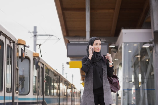 Woman in hijab talking on mobile phone