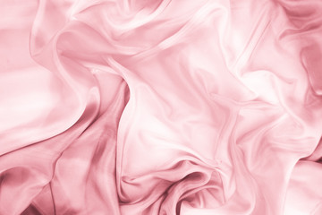 The texture of the satin fabric of pink color for the background  