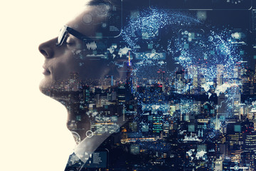 Double exposure of smart city and silhouette of businessman