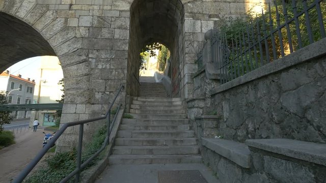 Stairs with an arched passageway