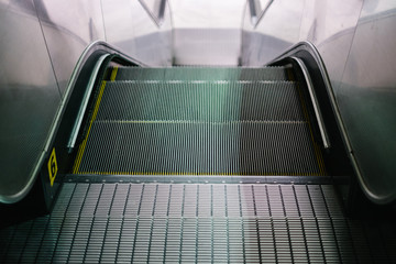 Escalator. Selective focus. Personal perspective. Copy space.