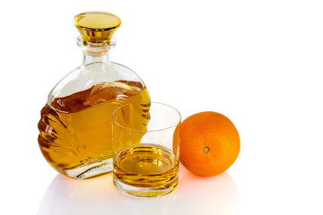 Decanter with the glass of whiskey and orange