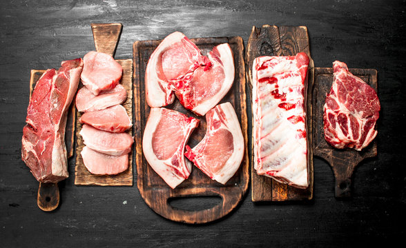 Different types of raw pork meat and beef.