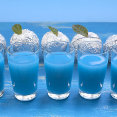 Five Glasses Blue Drink surrealism Apple Foil Blue Shabby background.